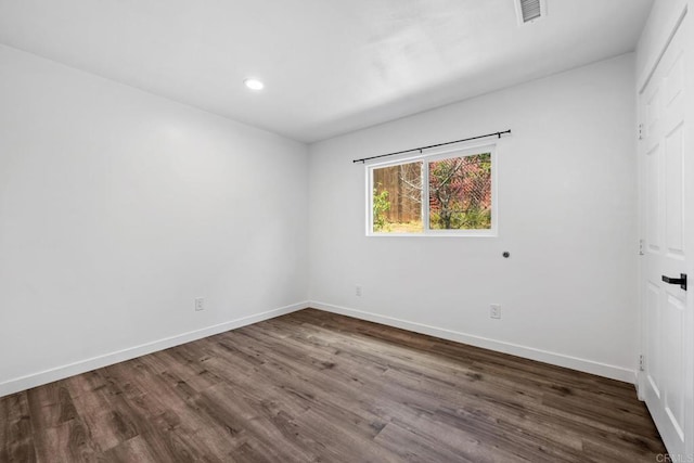 4585 Mount Henry Pl, San Diego, CA 92117 - empty room with dark wood finished floors, baseboards, and recessed lighting