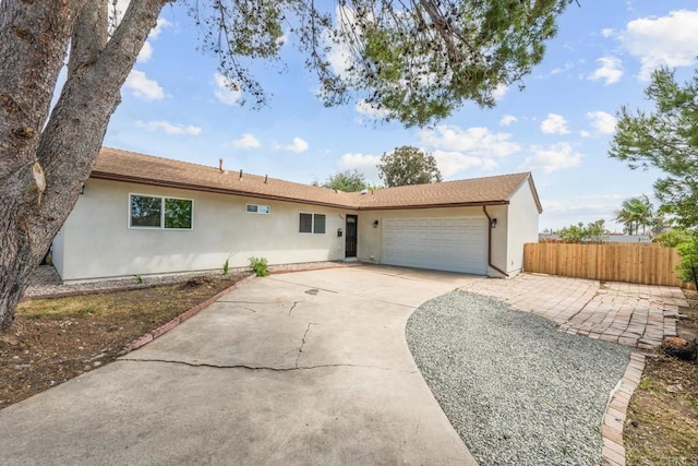 4585 Mount Henry Pl, San Diego, CA 92117 - ranch-style home with stucco siding, fence, an attached garage, and driveway