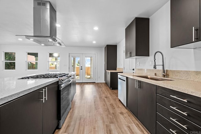4585 Mount Henry Pl, San Diego, CA 92117 - kitchen with appliances with stainless steel finishes, a sink, wall chimney exhaust hood, light wood-style floors, and light stone countertops