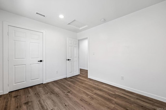 4585 Mount Henry Pl, San Diego, CA 92117 - unfurnished bedroom with attic access, wood finished floors, baseboards, and recessed lighting