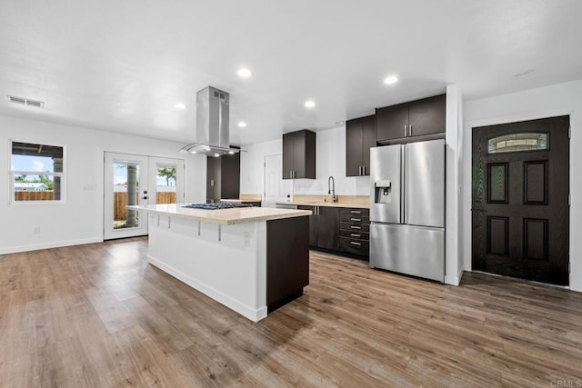 4585 Mount Henry Pl, San Diego, CA 92117 - kitchen featuring stainless steel fridge, island range hood, a kitchen island, light countertops, and a sink