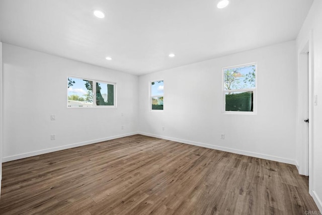 4585 Mount Henry Pl, San Diego, CA 92117 - unfurnished room featuring healthy amount of natural light, wood finished floors, recessed lighting, and baseboards