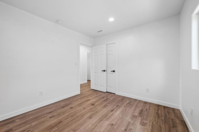 4585 Mount Henry Pl, San Diego, CA 92117 - unfurnished bedroom with wood finished floors, baseboards, and recessed lighting