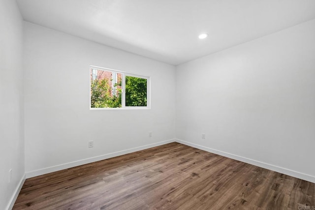 4585 Mount Henry Pl, San Diego, CA 92117 - unfurnished room with wood finished floors, baseboards, and recessed lighting