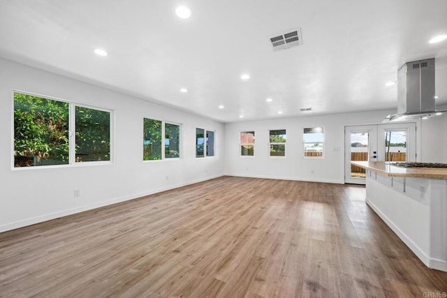 4585 Mount Henry Pl, San Diego, CA 92117 - unfurnished living room featuring wood finished floors, recessed lighting, baseboards, and french doors