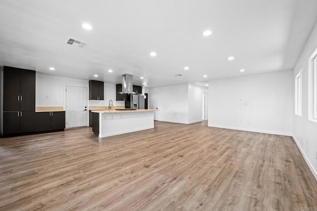 4585 Mount Henry Pl, San Diego, CA 92117 - unfurnished living room with recessed lighting and light wood-type flooring