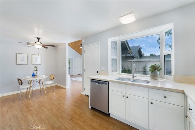 22986 Caminito Regalo Unit 92, Laguna Hills, CA 92653 - kitchen with dishwasher, a sink, white cabinetry, light wood-style floors, and a ceiling fan