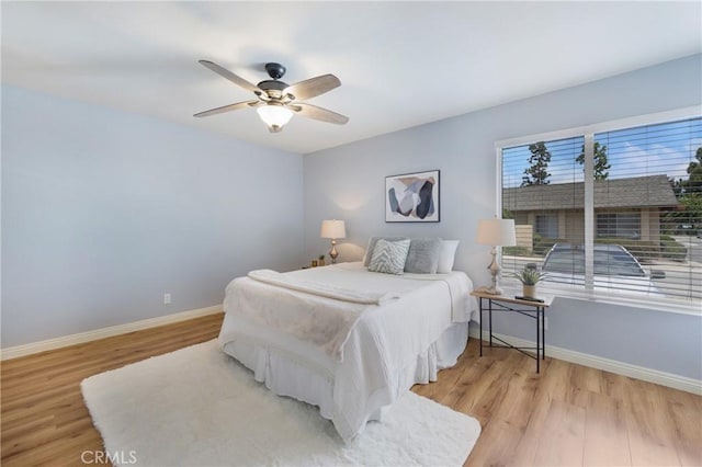 22986 Caminito Regalo Unit 92, Laguna Hills, CA 92653 - bedroom with light wood-type flooring, baseboards, and ceiling fan