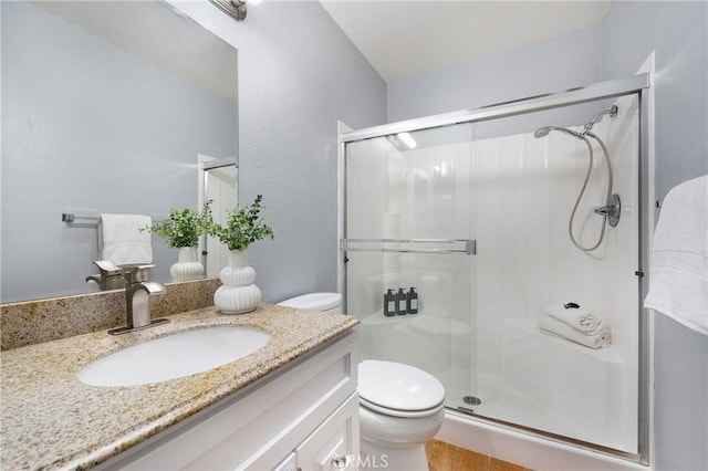 22986 Caminito Regalo Unit 92, Laguna Hills, CA 92653 - full bath featuring a shower stall, toilet, and vanity