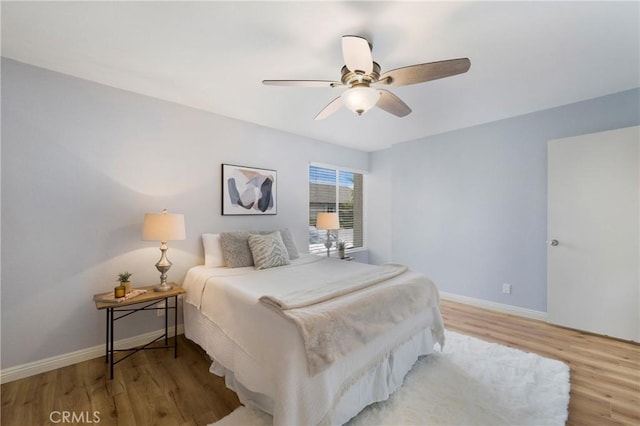 22986 Caminito Regalo Unit 92, Laguna Hills, CA 92653 - bedroom featuring wood finished floors, baseboards, and ceiling fan