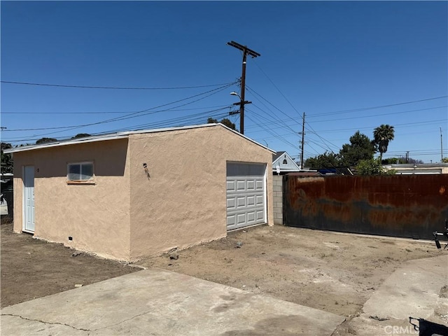 view of outdoor structure with fence