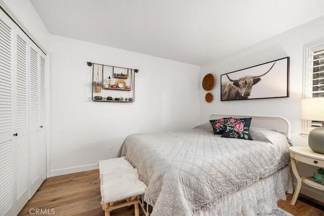 1762 Southfork Pl, Paso Robles, CA 93446 - bedroom featuring a closet, wood finished floors, and baseboards
