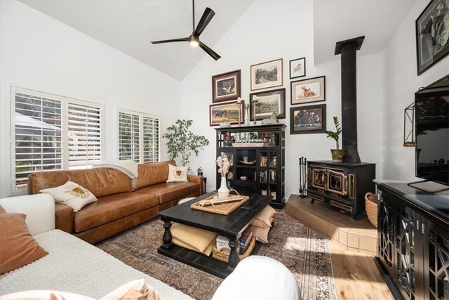 1762 Southfork Pl, Paso Robles, CA 93446 - living room with a wood stove, a ceiling fan, high vaulted ceiling, plenty of natural light, and wood finished floors