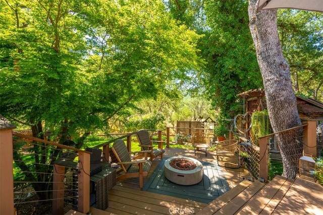 1762 Southfork Pl, Paso Robles, CA 93446 - wooden deck featuring an outdoor fire pit