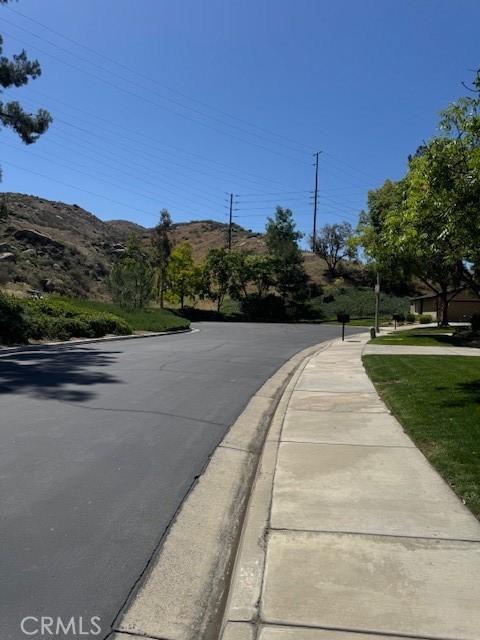 512 Via Ln, Paloma, Riverside, CA 92507 - view of asphalt street featuring sidewalks and curbs
