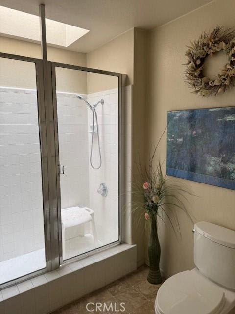 512 Via Ln, Paloma, Riverside, CA 92507 - full bath featuring a shower stall, a skylight, and tile patterned floors