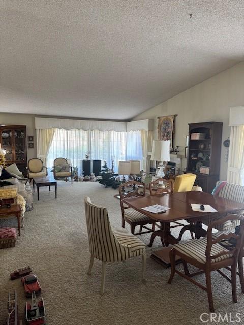 512 Via Ln, Paloma, Riverside, CA 92507 - carpeted dining space with a textured ceiling