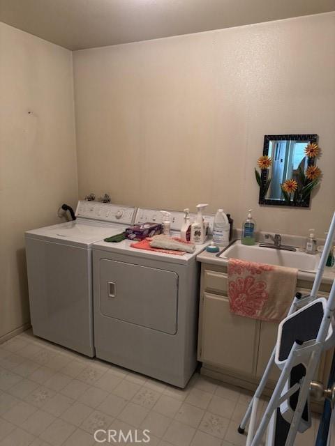 512 Via Ln, Paloma, Riverside, CA 92507 - washroom featuring washer and dryer, cabinet space, and light floors