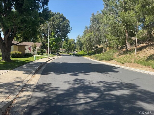 512 Via Ln, Paloma, Riverside, CA 92507 - view of asphalt street with curbs, street lighting, and sidewalks