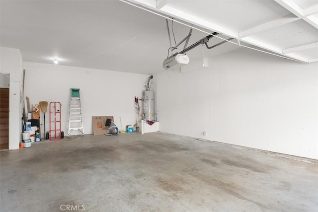 garage with water heater and a garage door opener