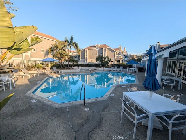 4682 Warner Ave Unit B102, Huntington Beach, CA 92649 - community pool featuring a patio area and a residential view