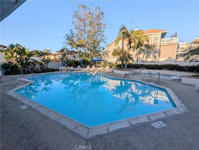 4682 Warner Ave Unit B102, Huntington Beach, CA 92649 - community pool with a patio area and a community hot tub