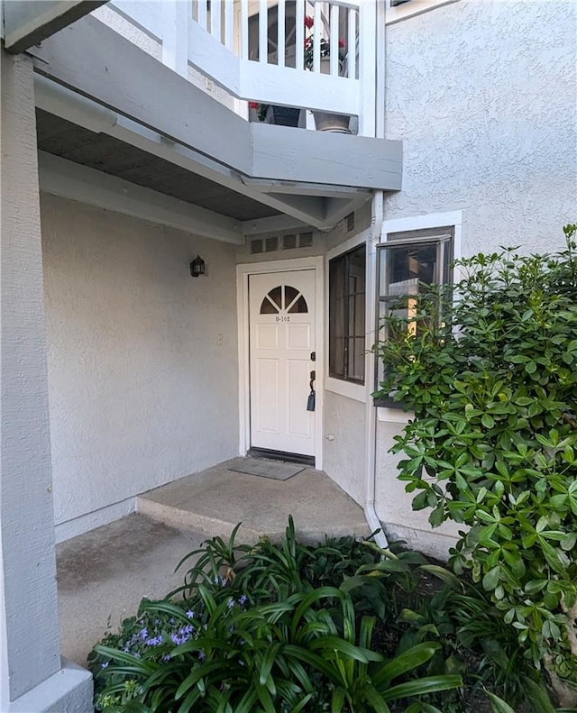 4682 Warner Ave Unit B102, Huntington Beach, CA 92649 - entrance to property featuring a balcony and stucco siding