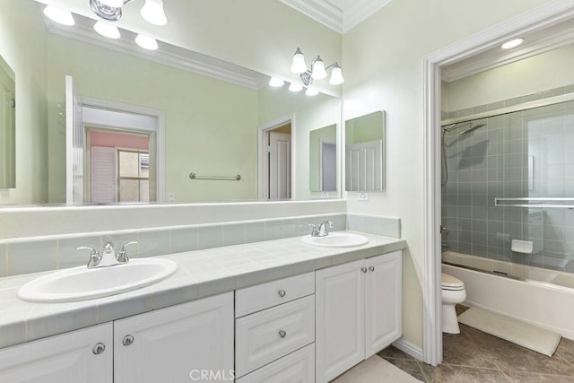 4067 Hoosier Lawn Way, Yorba Linda, CA 92886 - full bathroom featuring crown molding, toilet, double vanity, tile patterned flooring, and combined bath / shower with glass door