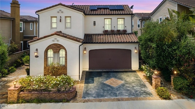 4067 Hoosier Lawn Way, Yorba Linda, CA 92886 - mediterranean / spanish-style house featuring a tile roof, a garage, stucco siding, driveway, and solar panels