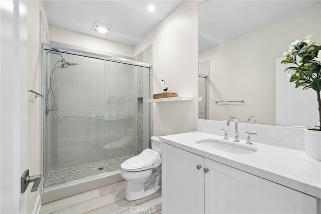 143 Trumpet Flower, Irvine, CA 92618 - bathroom with a shower stall, toilet, vanity, and recessed lighting