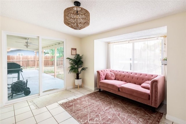 57966 El Dorado Dr, Yucca Valley, CA 92284 - tiled living room with a textured ceiling and baseboards