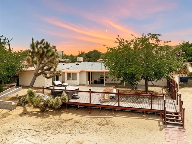 57966 El Dorado Dr, Yucca Valley, CA 92284 - back of property featuring a wooden deck and stucco siding
