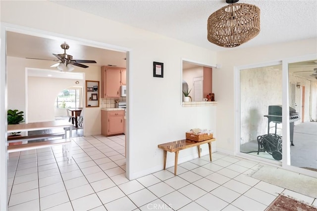57966 El Dorado Dr, Yucca Valley, CA 92284 - living area with ceiling fan, a textured ceiling, and light tile patterned flooring