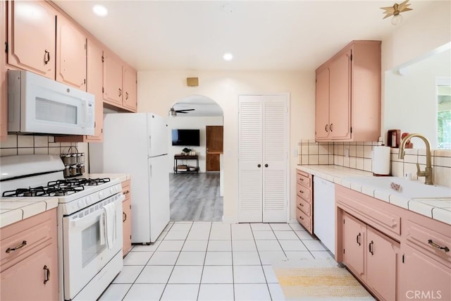 57966 El Dorado Dr, Yucca Valley, CA 92284 - kitchen featuring white appliances, tile countertops, a sink, decorative backsplash, and recessed lighting