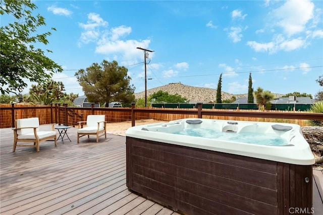 57966 El Dorado Dr, Yucca Valley, CA 92284 - wooden terrace featuring a hot tub and a fenced backyard