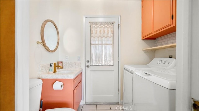 57966 El Dorado Dr, Yucca Valley, CA 92284 - laundry area with separate washer and dryer and light tile patterned floors