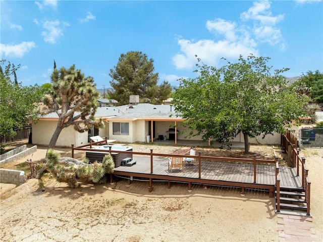 57966 El Dorado Dr, Yucca Valley, CA 92284 - back of property with a deck, fence, and stucco siding