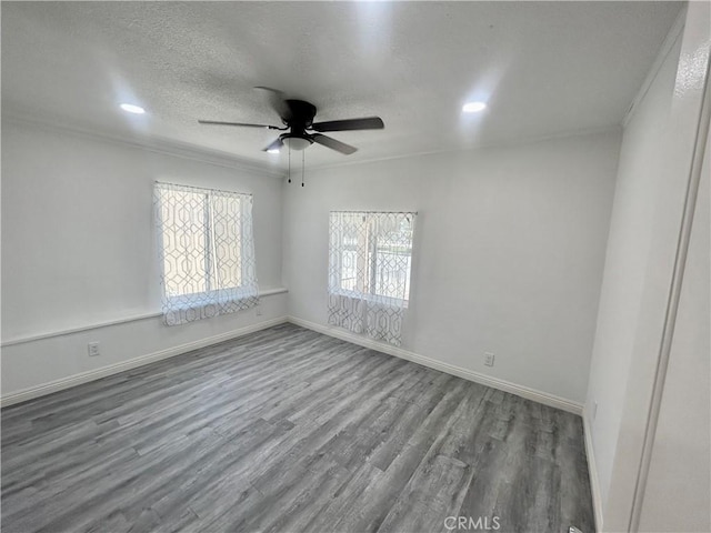 128 E 1st St, Buttonwillow, CA 93206 - empty room featuring a ceiling fan, wood finished floors, a textured ceiling, baseboards, and recessed lighting