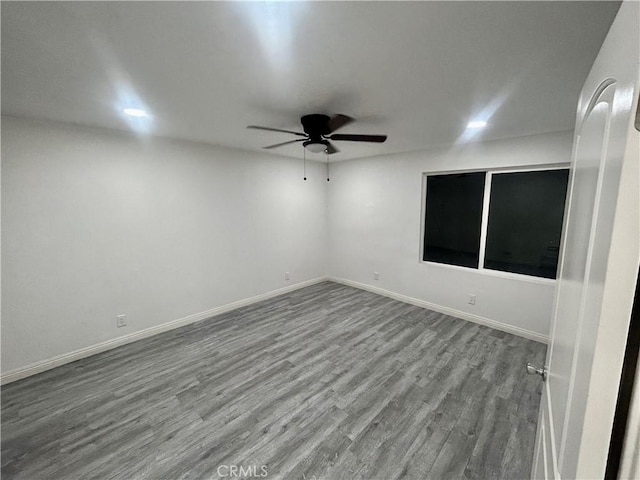 128 E 1st St, Buttonwillow, CA 93206 - empty room with ceiling fan, wood finished floors, and baseboards