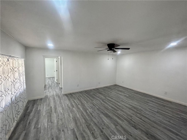 128 E 1st St, Buttonwillow, CA 93206 - unfurnished room with ceiling fan, dark wood finished floors, and baseboards