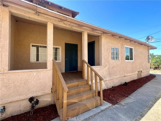 128 E 1st St, Buttonwillow, CA 93206 - entrance to property with stucco siding
