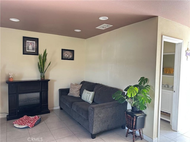 23610 David Ln Unit 1, Moreno Valley, CA 92557 - living room with light tile patterned floors, recessed lighting, and a baseboard heating unit