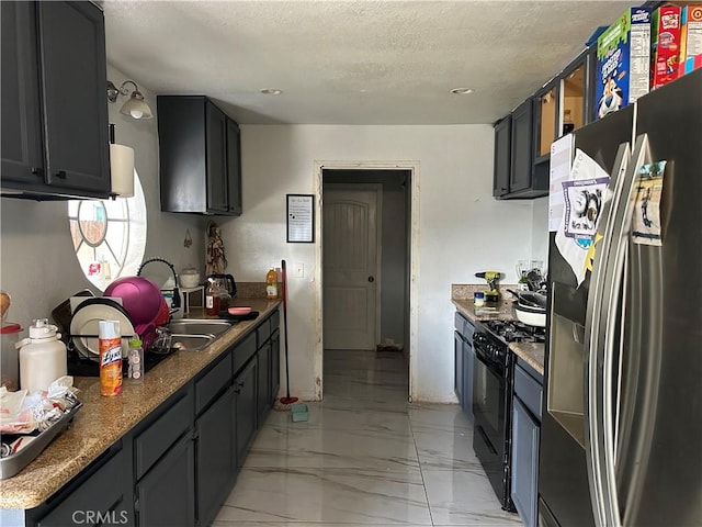 23610 David Ln Unit 1, Moreno Valley, CA 92557 - kitchen with stainless steel refrigerator with ice dispenser, black range with gas cooktop, light marble finish flooring, a textured ceiling, and recessed lighting