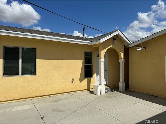 23610 David Ln Unit 1, Moreno Valley, CA 92557 - view of exterior entry featuring stucco siding and a patio area