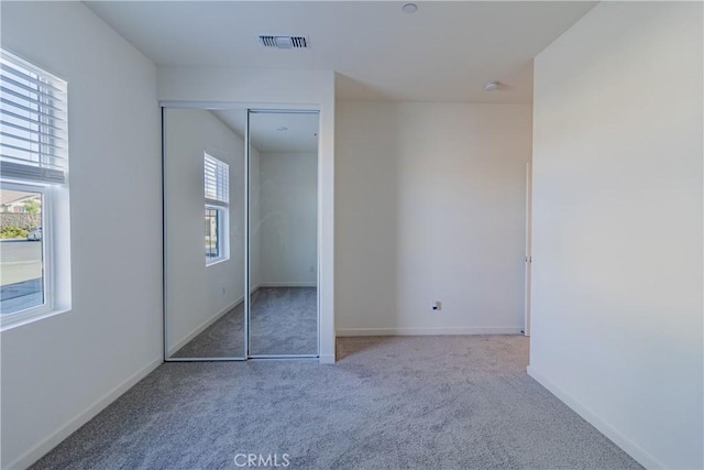 41207 Alegria Ln, Lake Elsinore, CA 92532 - unfurnished bedroom with carpet floors, baseboards, and a closet