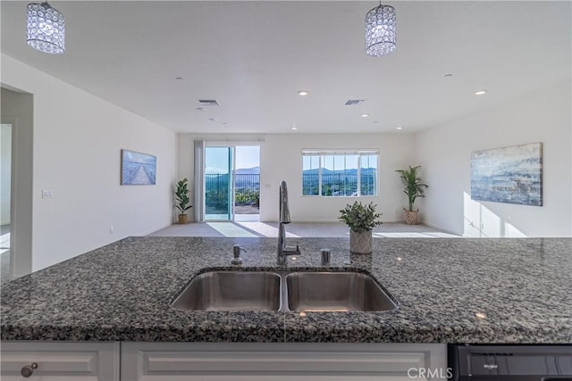 41207 Alegria Ln, Lake Elsinore, CA 92532 - kitchen featuring a sink, open floor plan, dark stone counters, dishwashing machine, and recessed lighting