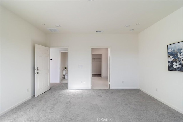 41207 Alegria Ln, Lake Elsinore, CA 92532 - unfurnished bedroom with carpet floors, baseboards, and a walk in closet