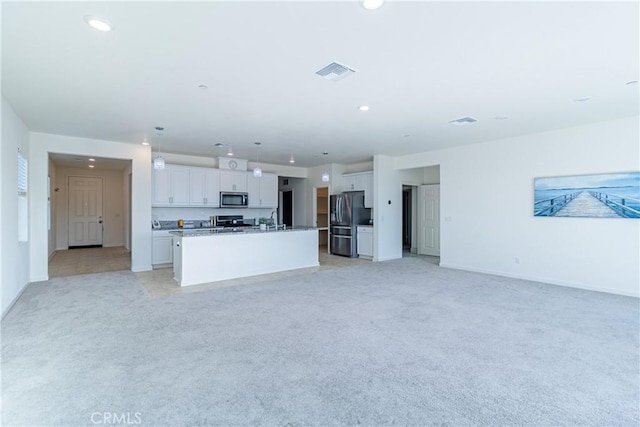 41207 Alegria Ln, Lake Elsinore, CA 92532 - unfurnished living room with light carpet, baseboards, a sink, and recessed lighting