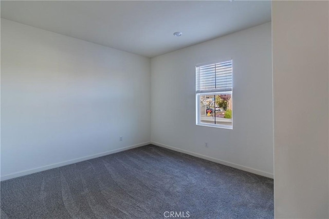 41207 Alegria Ln, Lake Elsinore, CA 92532 - unfurnished room with dark colored carpet and baseboards