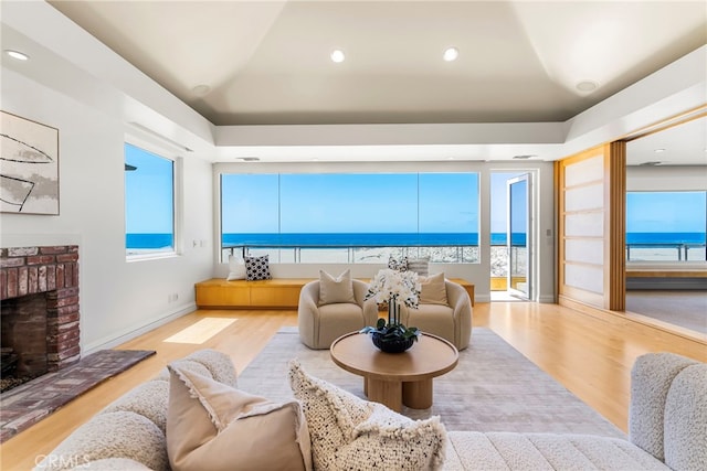1554 E Oceanfront, Newport Beach, CA 92661 - living room with wood finished floors, a fireplace, healthy amount of natural light, and recessed lighting